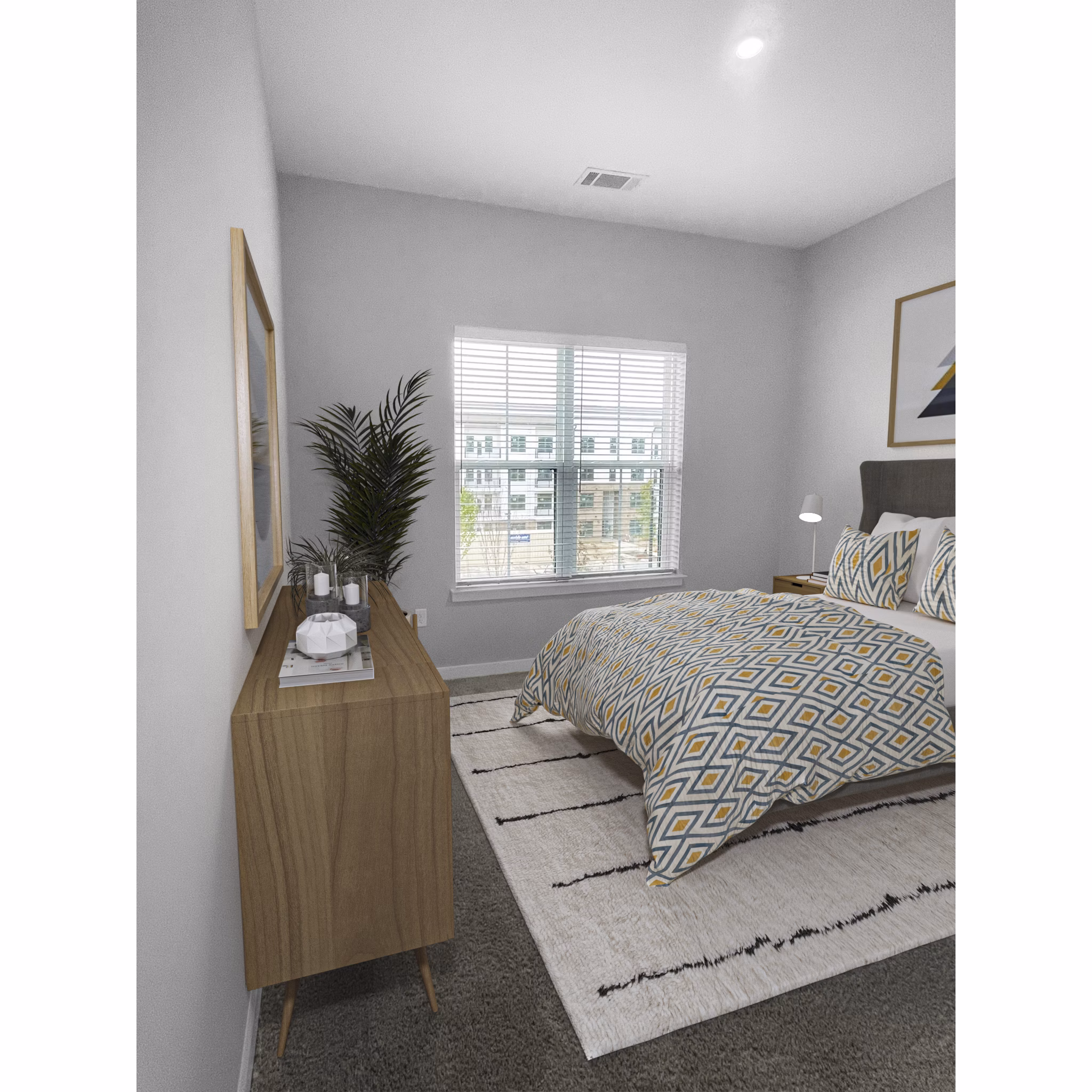 Elegant bedroom with plush bedding and modern decor at Camellia at One Nexton Apartments
