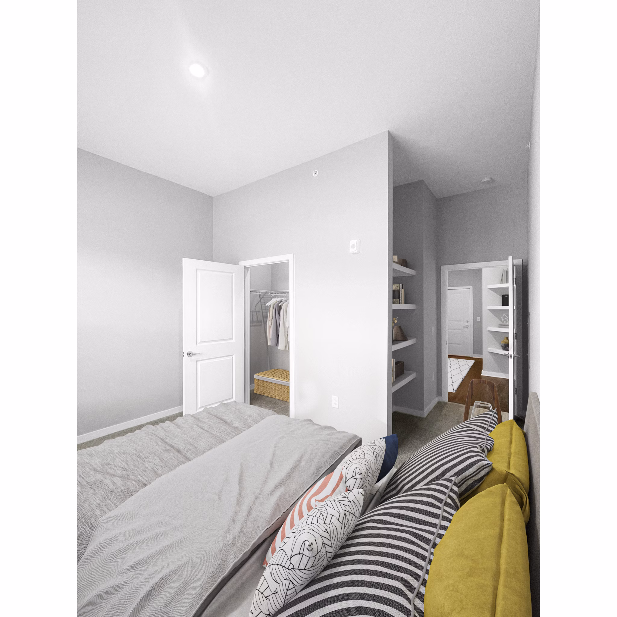 Bedroom featuring elegant decor and large windows at Camellia at One Nexton Apartments