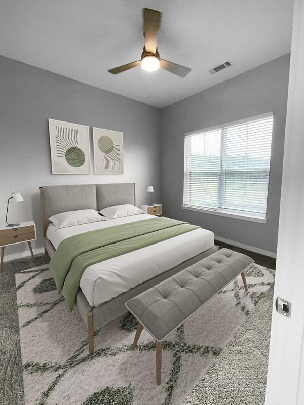 Cozy bedroom with modern decor and ample natural light at Camellia at One Nexton Apartments