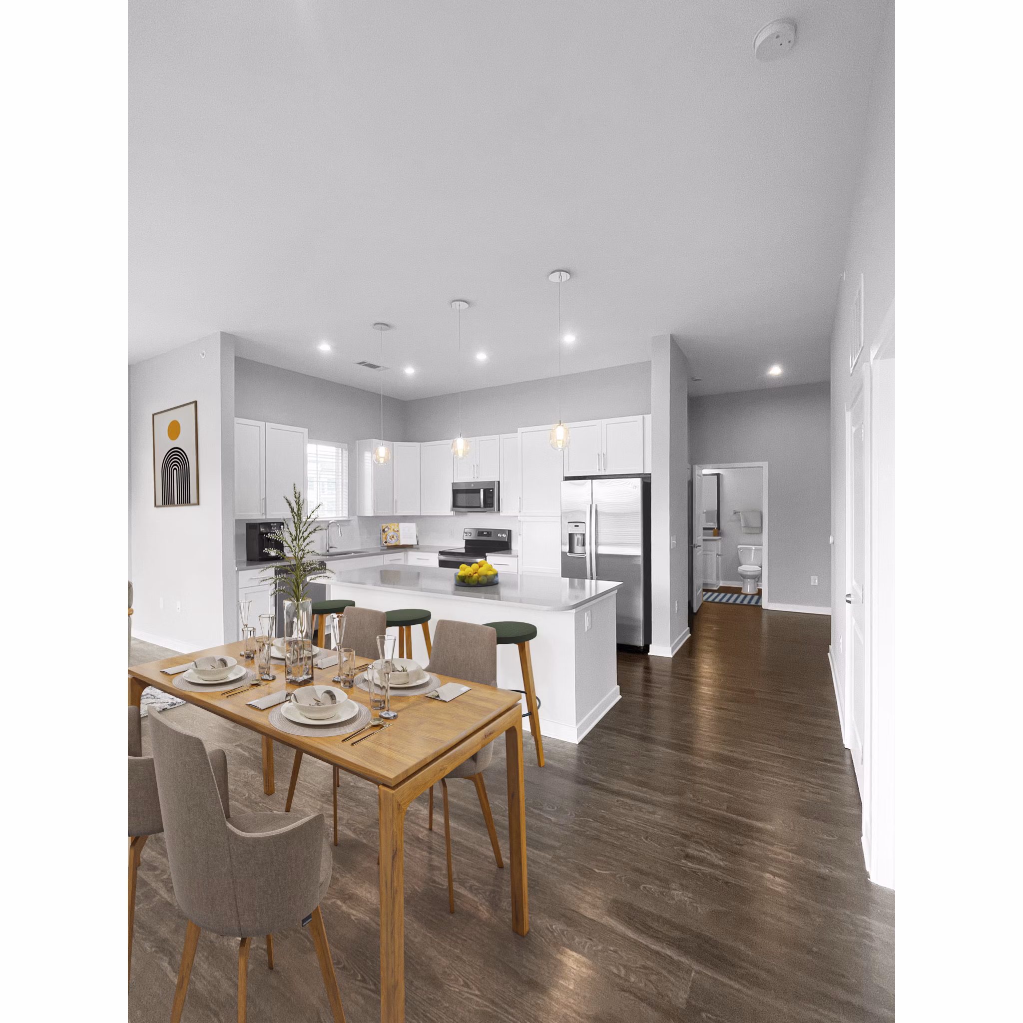 Dining room with elegant lighting and contemporary furniture at Camellia at One Nexton Apartments