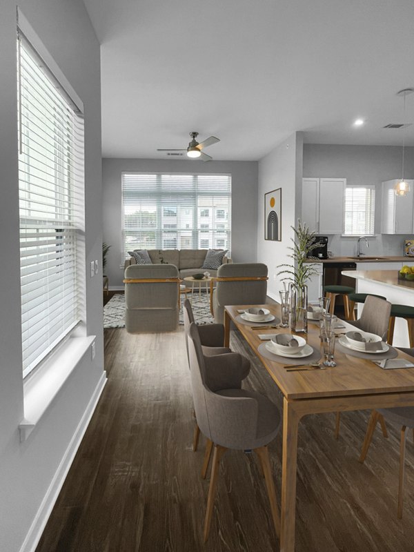 Dining room featuring modern furniture and stylish lighting at Camellia at One Nexton Apartments