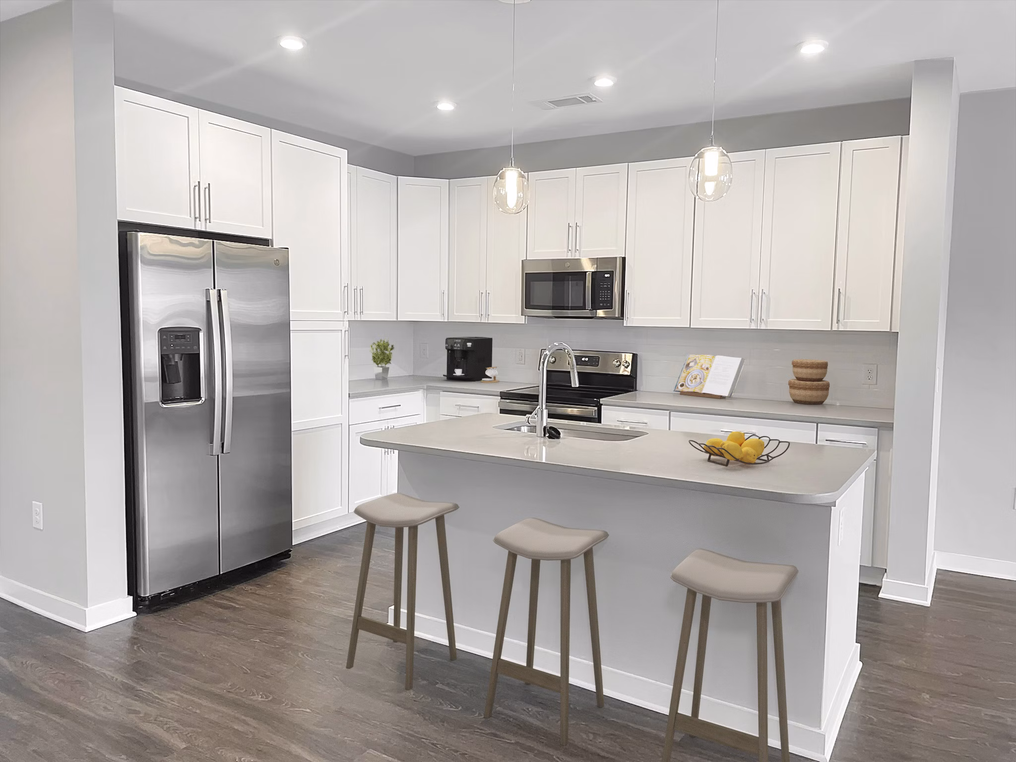 Kitchens showcasing granite countertops and stainless appliances at Camellia at One Nexton luxury apartments