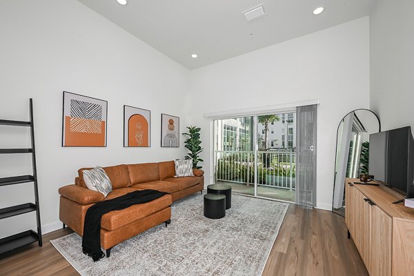 Spacious living room with modern furnishings at Apollo Apartments