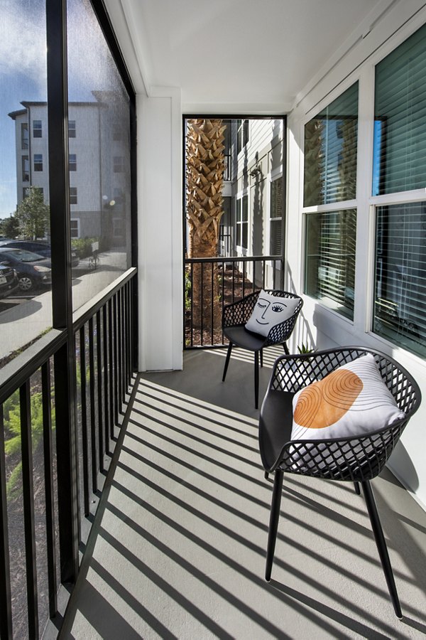 Modern patio with elegant seating at SUR Lake Buena Vista Apartments in Florida, offering luxurious outdoor living spaces