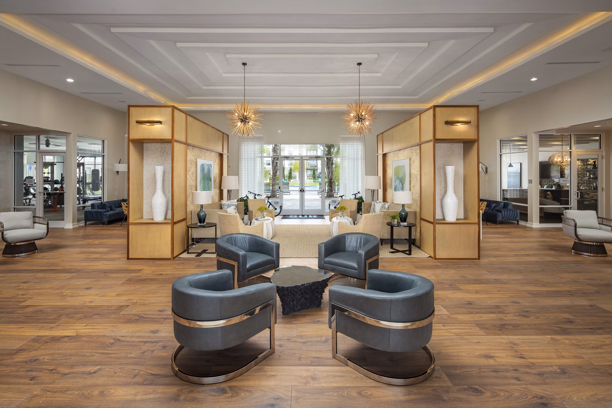 Contemporary clubhouse with stylish seating and modern decor at SUR Southside Quarter Apartments