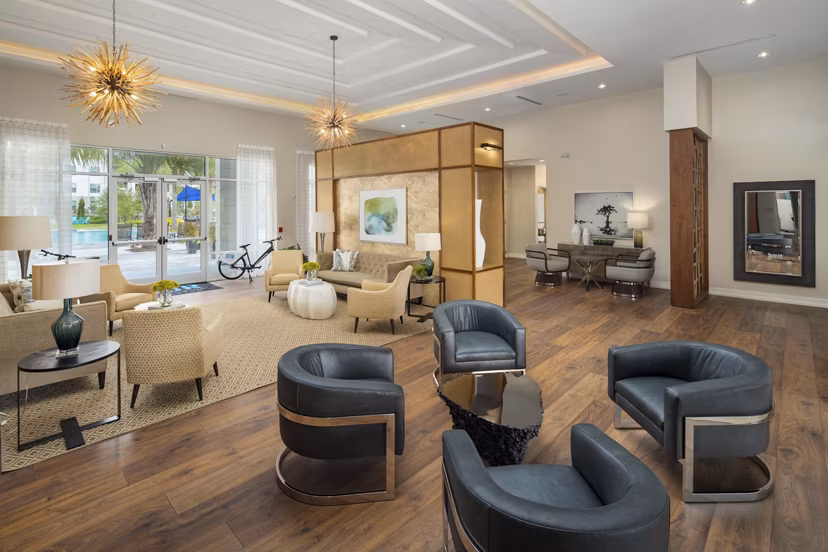 Clubhouse featuring modern lounge and entertainment spaces at SUR Southside Quarter Apartments