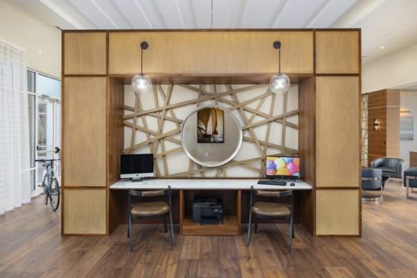 Clubhouse with modern furnishings at SUR Southside Quarter Apartments offering luxury amenities and community spaces