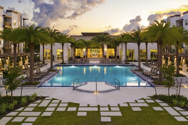 Resort-style pool with sundeck at SUR Southside Quarter Apartments