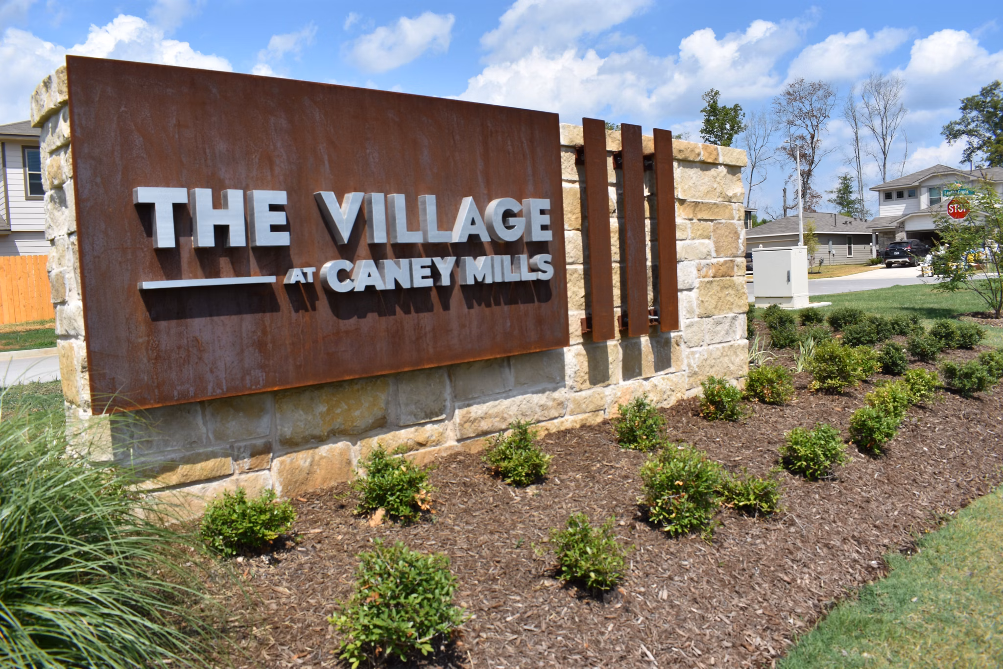 signage at Village at Caney Mills Apartments
