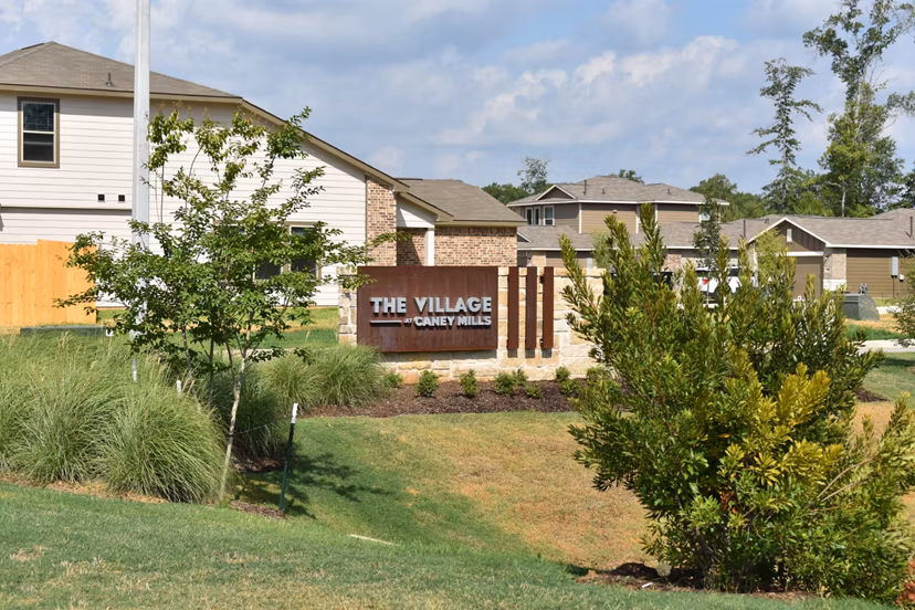 signage at Village at Caney Mills Apartments