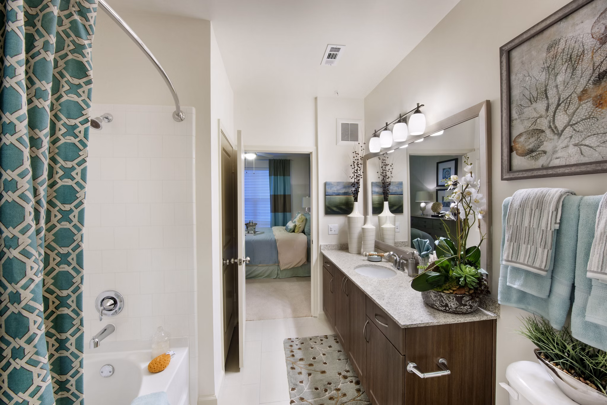 Bathroom featuring sleek fixtures and elegant tilework at The Views at Harbortown Apartments