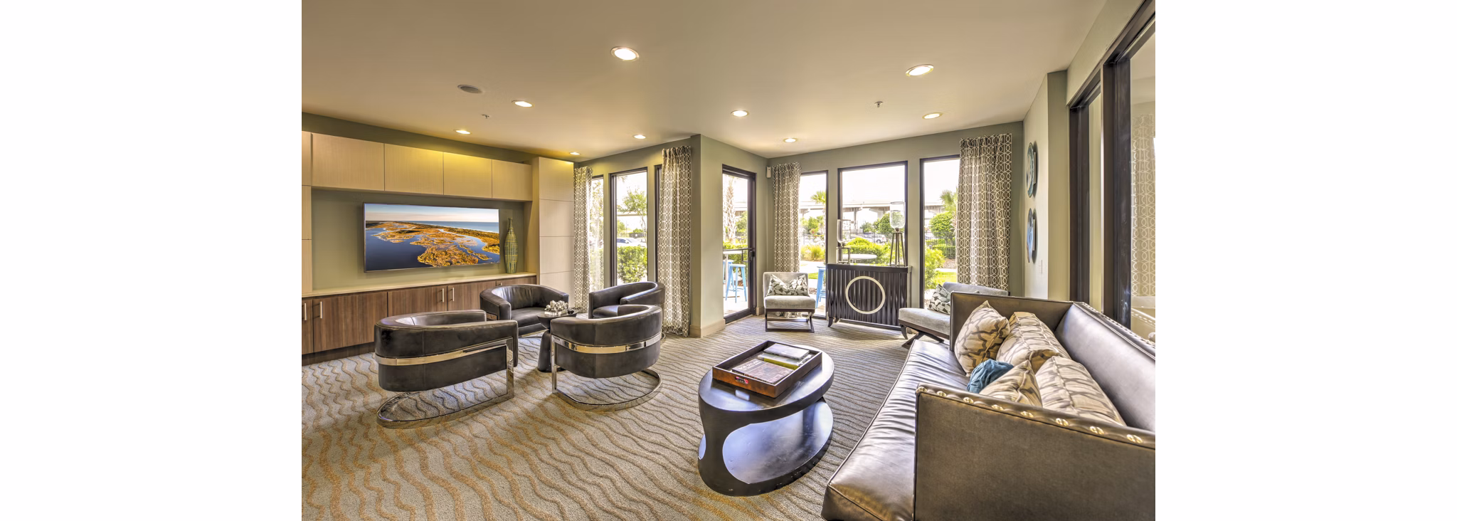 The Views at Harbortown: Modern clubhouse featuring luxurious decor and ample seating