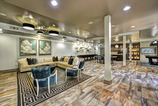 Luxurious clubhouse with modern furnishings at The Views at Harbortown Apartments, offering residents a stylish space to relax and socialize