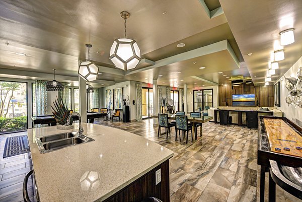 Clubhouse with modern decor and ample seating at The Views at Harbortown Apartments