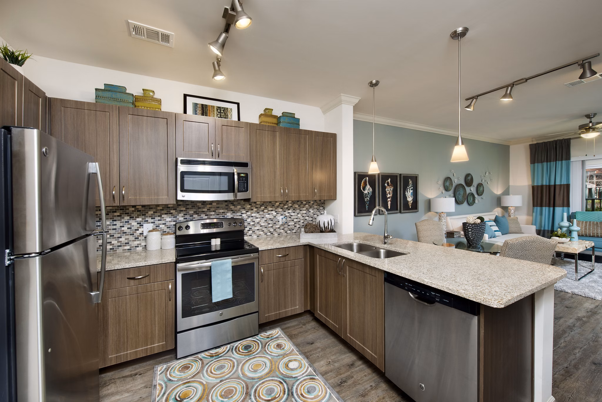 Kitchen with sleek countertops and modern appliances at The Views at Harbortown Apartments, offering luxury living spaces by the waterfront
