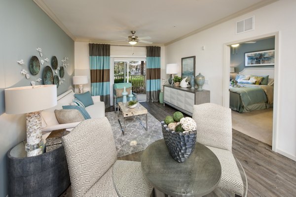 Spacious living room with coastal views at The Views at Harbortown Apartments