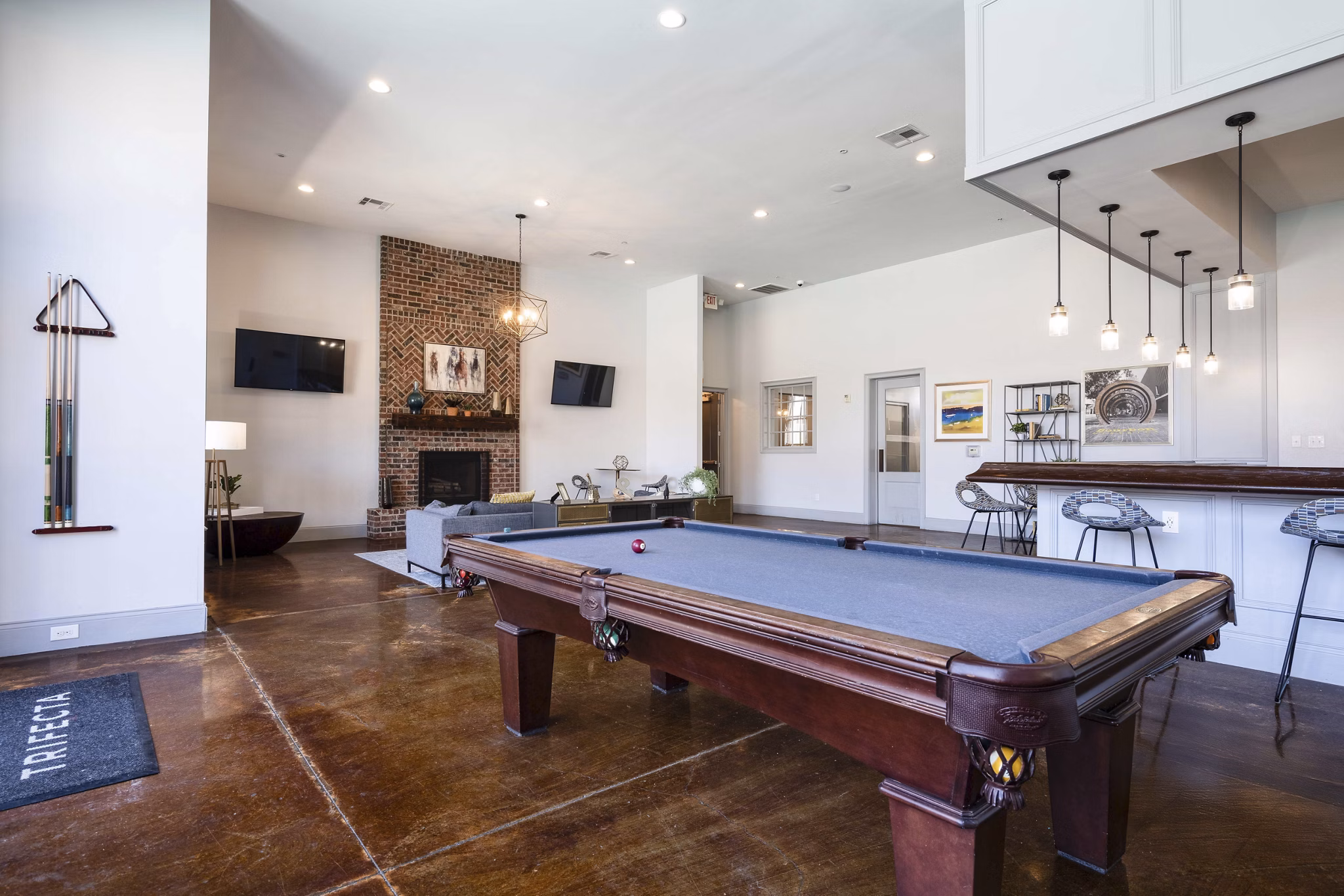 clubhouse game room at Trifecta Apartments