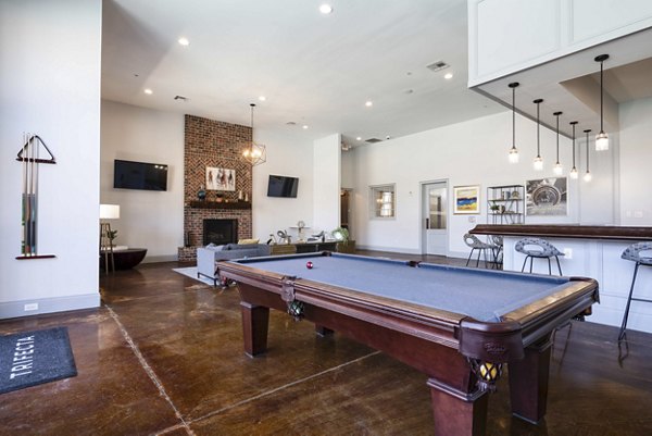clubhouse game room at Trifecta Apartments