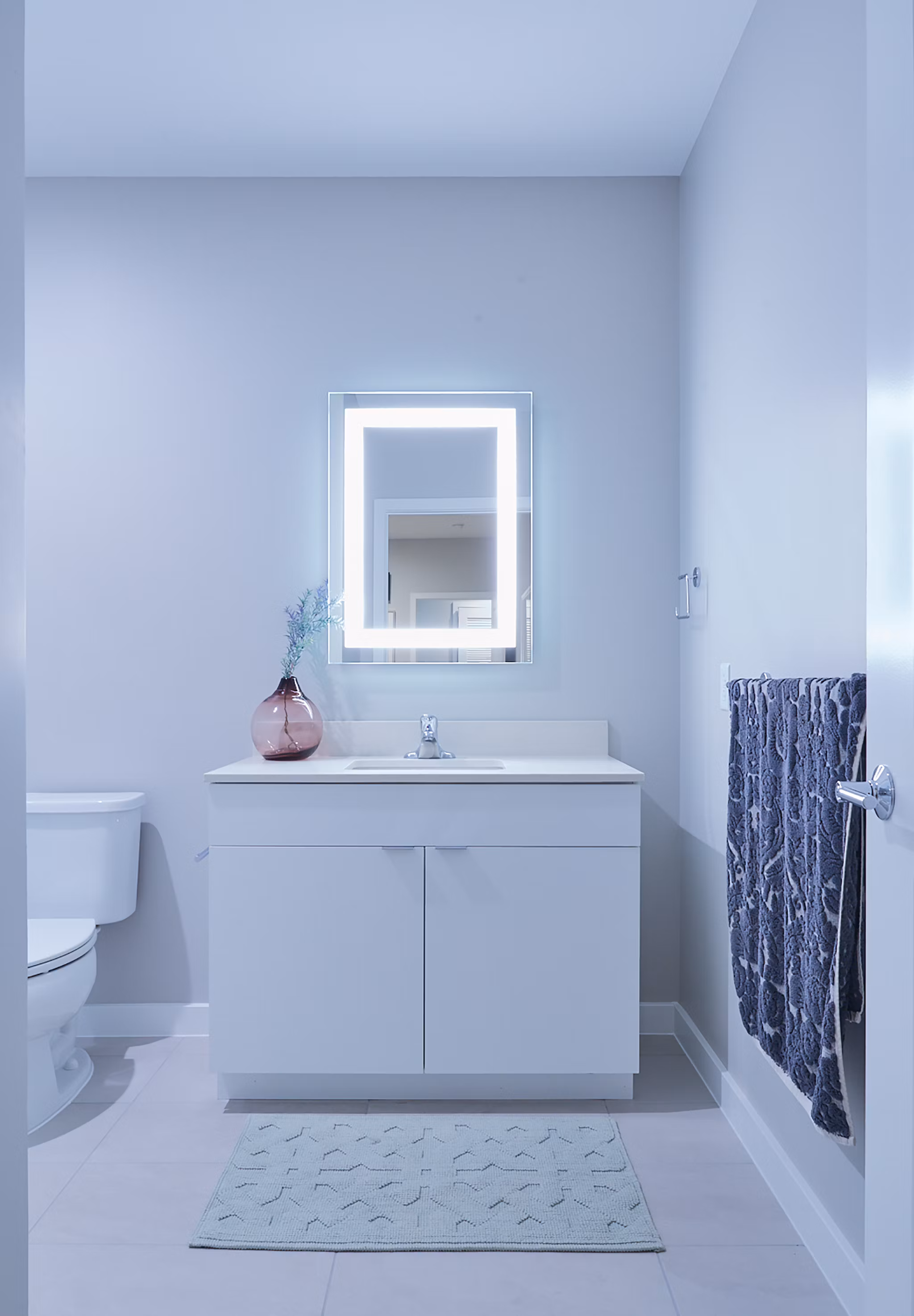 Modern bathroom with sleek fixtures and marble accents at The Highline Apartments