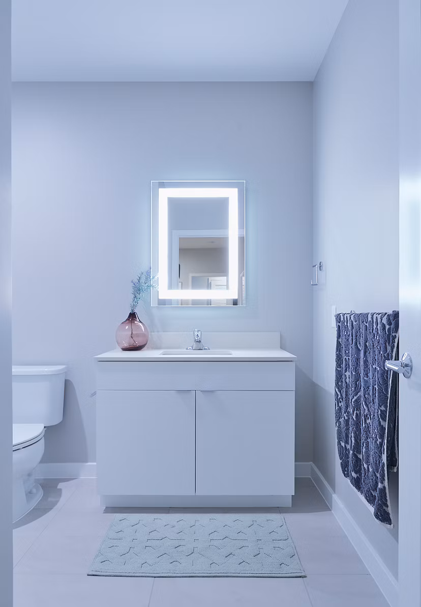 Modern bathroom with sleek fixtures and marble accents at The Highline Apartments