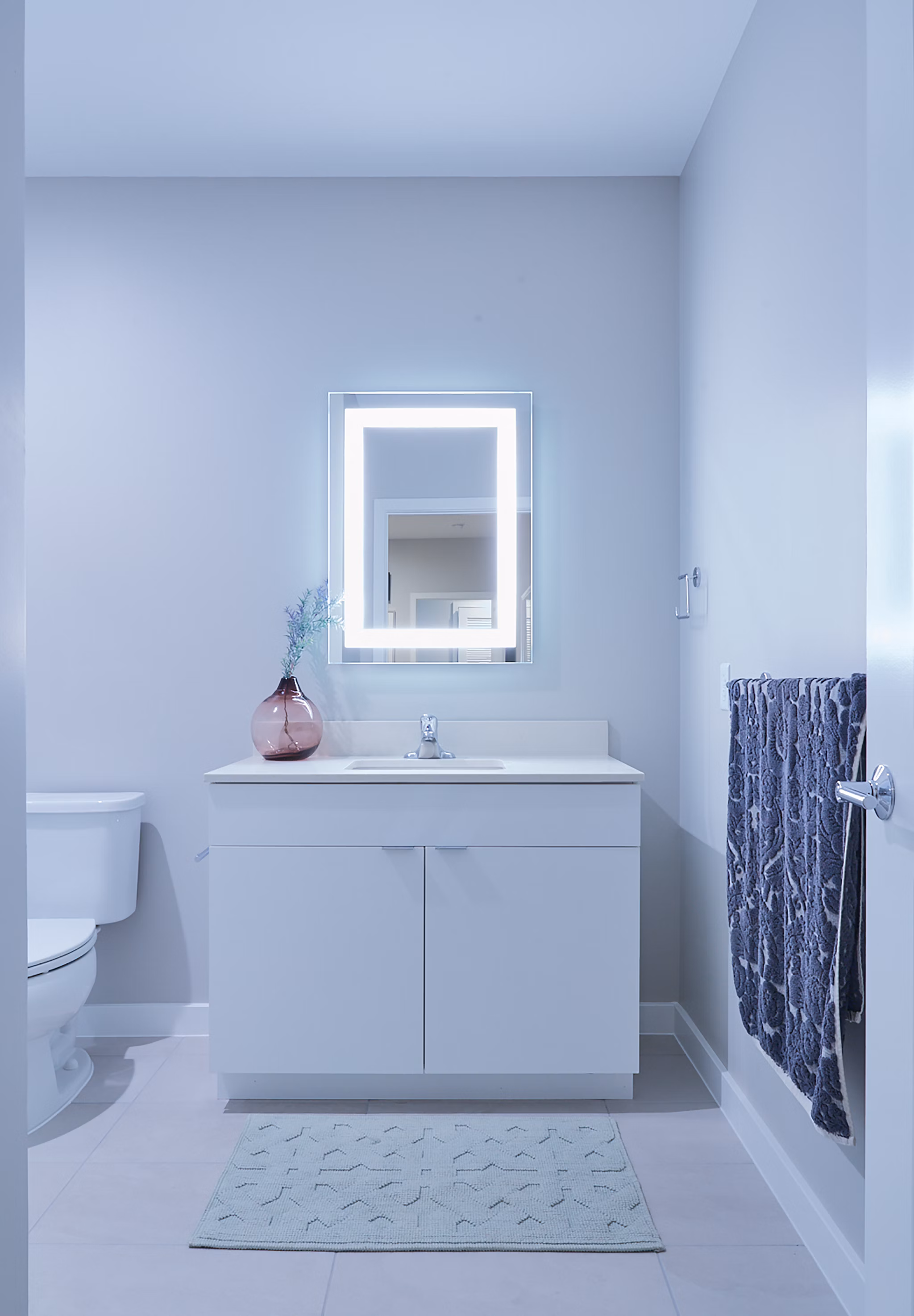 Modern bathroom with sleek fixtures and marble accents at The Highline Apartments