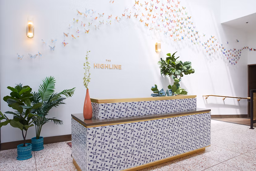 Clubhouse with modern seating and pool table at The Highline Apartments, offering luxury communal spaces for residents