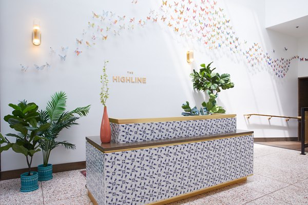 Clubhouse with modern seating and pool table at The Highline Apartments, offering luxury communal spaces for residents