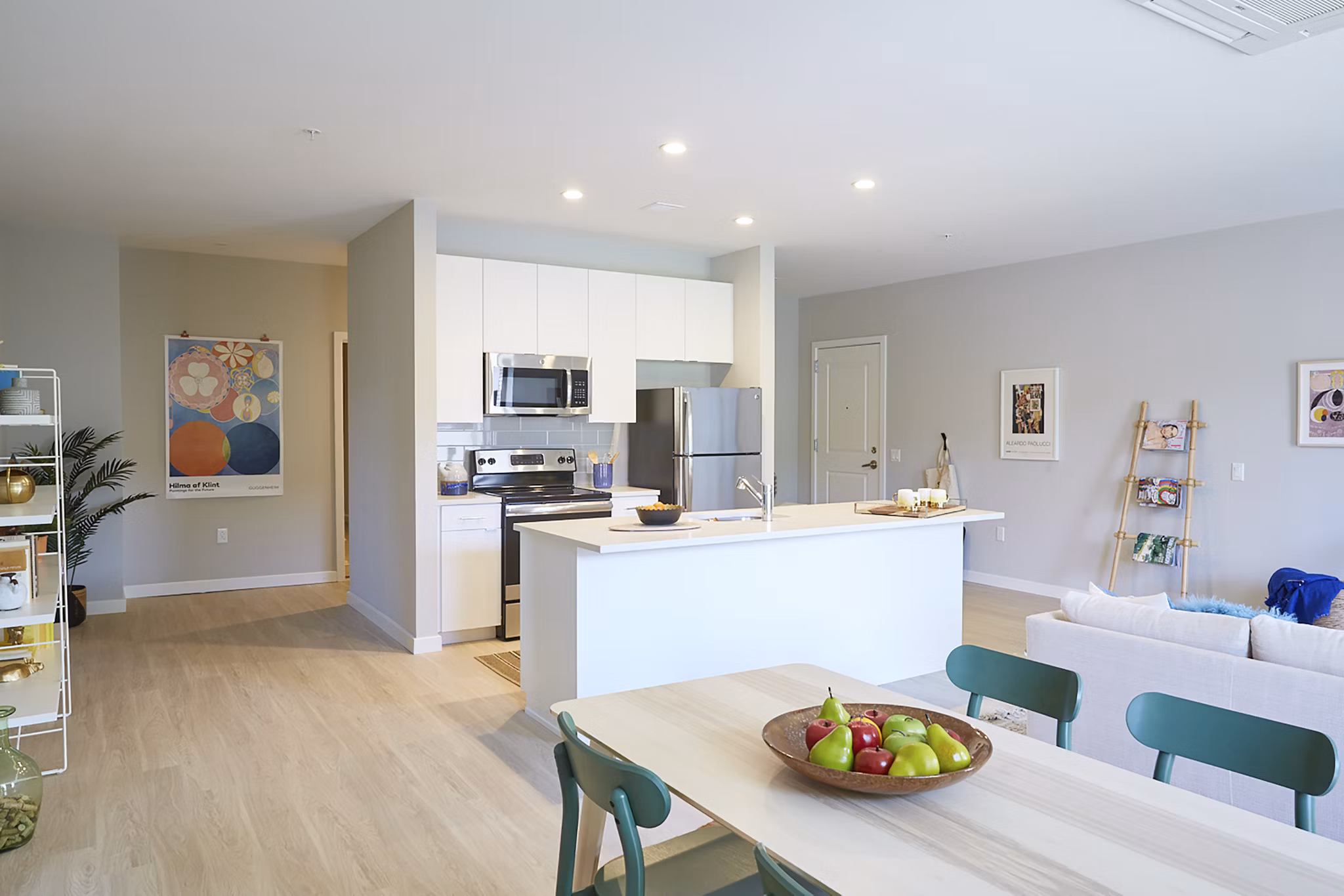 Kitchen featuring modern appliances and sleek countertops at The Highline Apartments