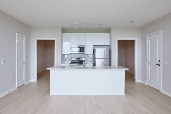 The Highline Apartments: Modern kitchen with stainless steel appliances and granite countertops