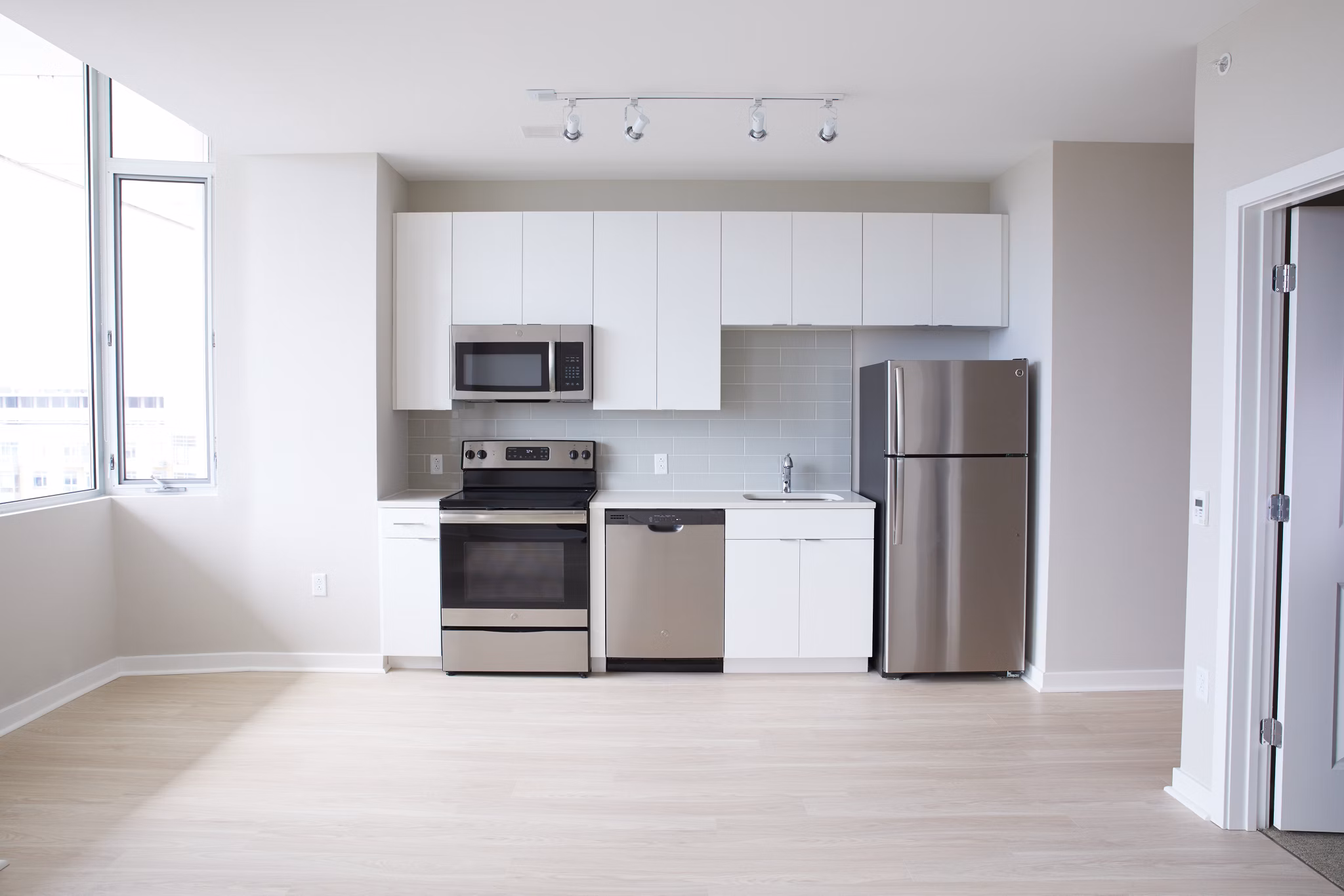 Modern kitchen with stainless steel appliances at The Highline Apartments