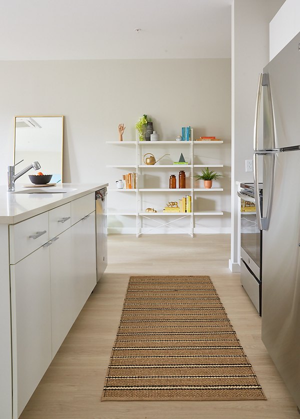 Modern kitchen with stainless steel appliances at The Highline Apartments