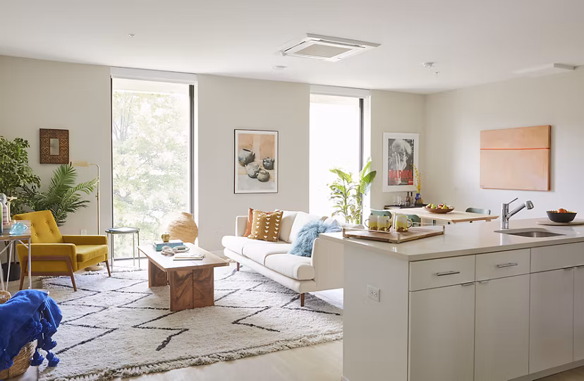 Living room with modern furnishings and large windows at The Highline Apartments, offering luxury living in a vibrant community