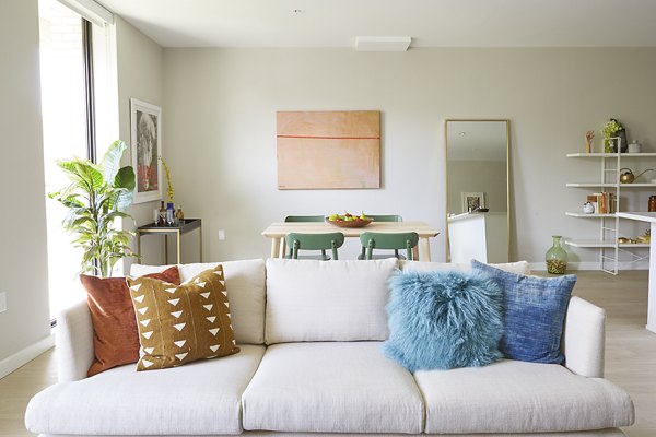 Spacious living room with contemporary design elements in The Highline Apartments