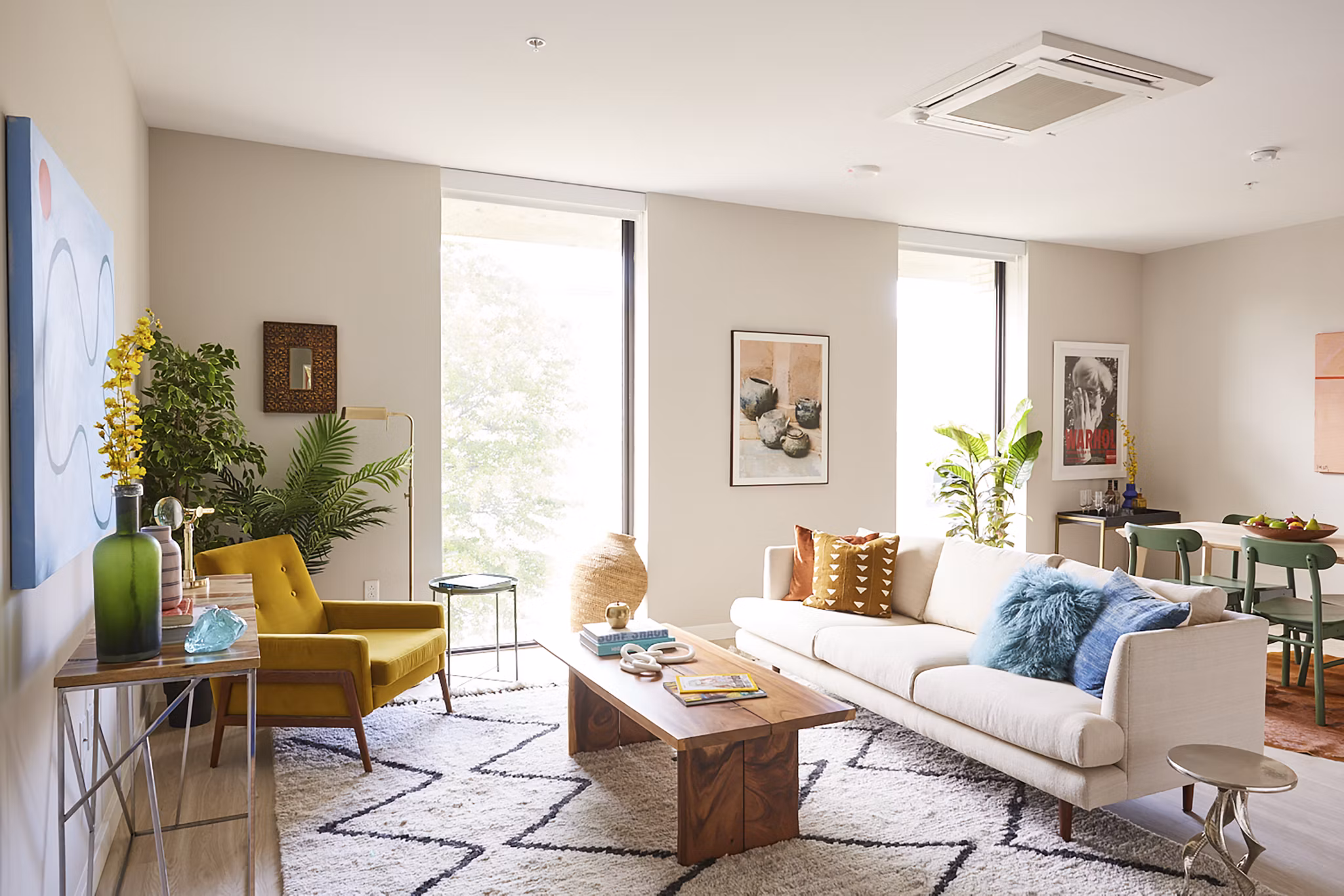 Spacious living room with modern decor in The Highline Apartments