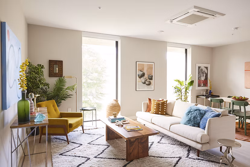 Spacious living room with modern decor in The Highline Apartments