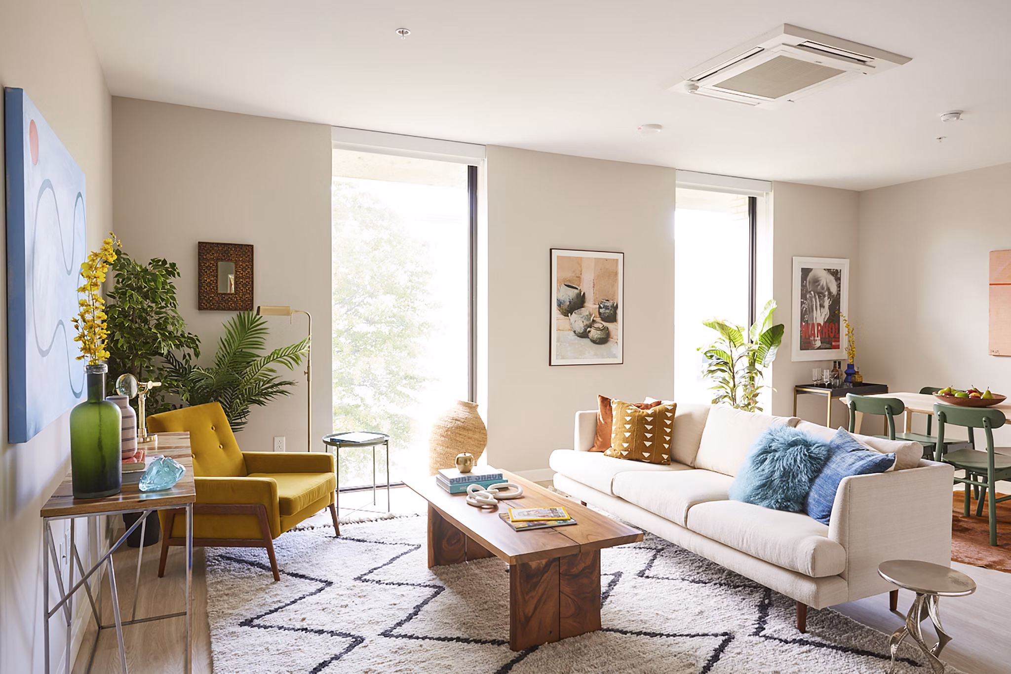 Spacious living room with modern decor in The Highline Apartments