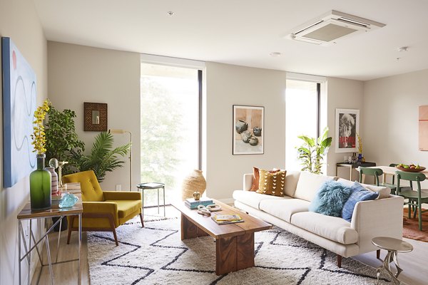 Spacious living room with modern decor in The Highline Apartments