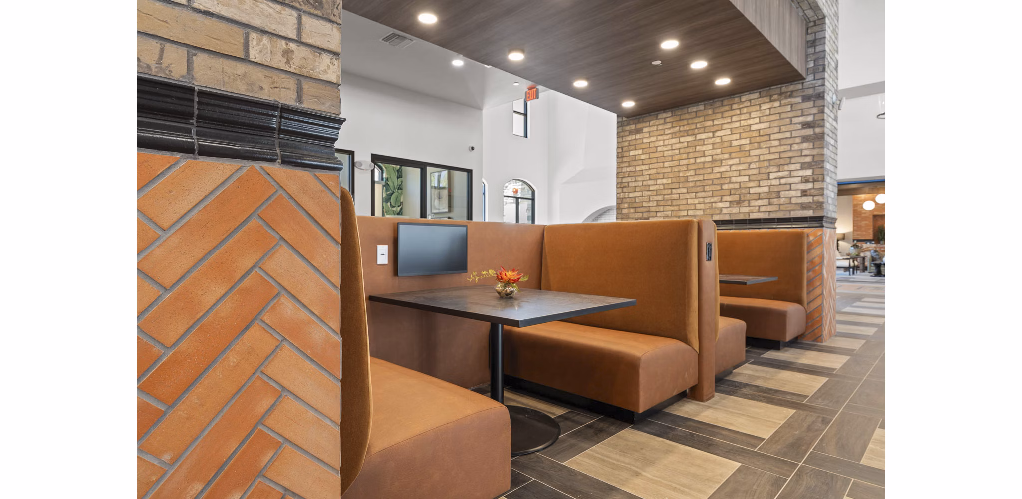 Elegant clubhouse with modern decor at Solara Vista Apartments perfect for gatherings, featuring cozy seating and stylish design