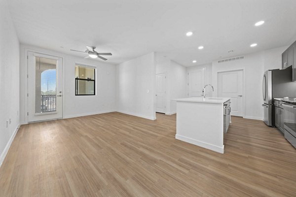 Spacious living room with modern decor and natural light at Solara Vista Apartments