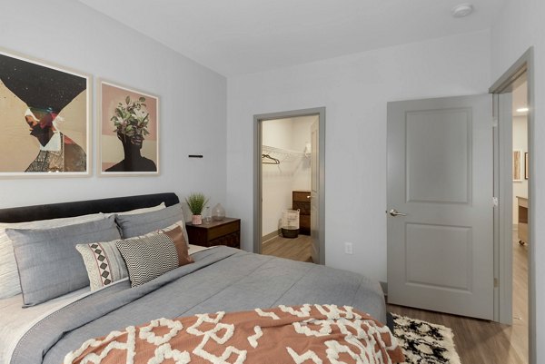 Union Heights Apartments: Luxurious bedroom with modern decor and ample natural light