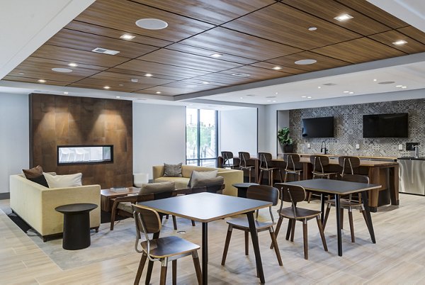 Modern clubhouse with communal seating and large windows at Union Heights Apartments