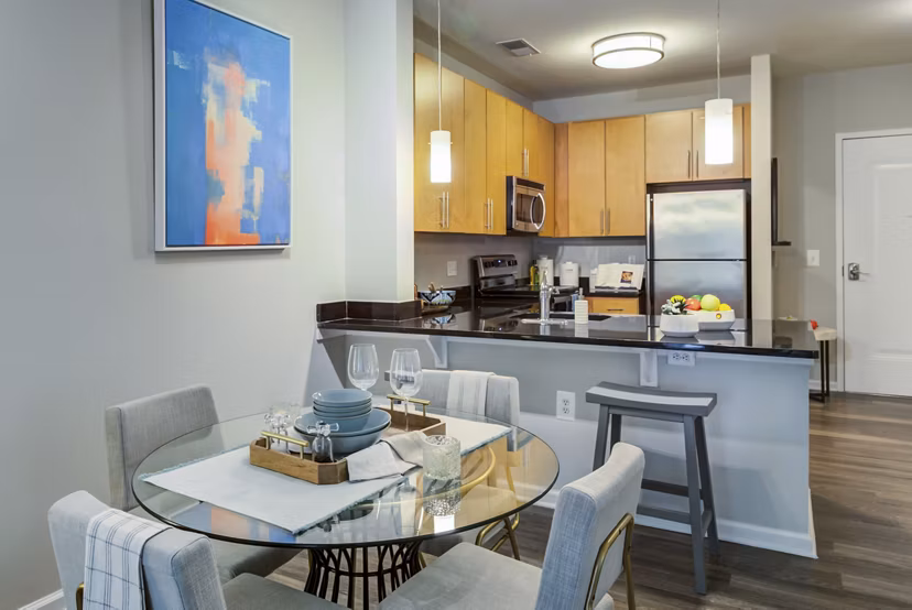 Modern dining area with sleek furniture and pendant lighting at Union Heights Apartments