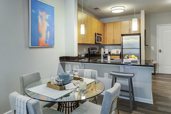 Modern dining area with sleek furniture and pendant lighting at Union Heights Apartments