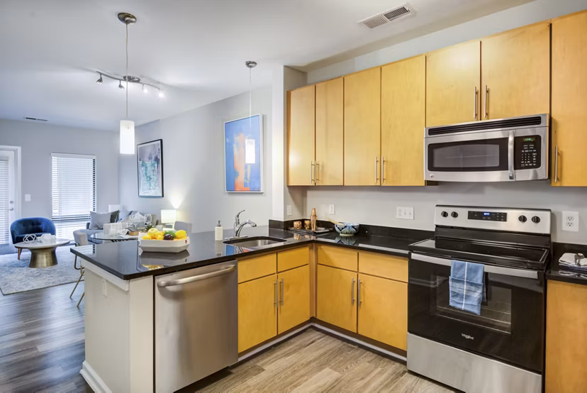 Modern kitchen featuring stainless steel appliances and granite countertops at Union Heights Apartments