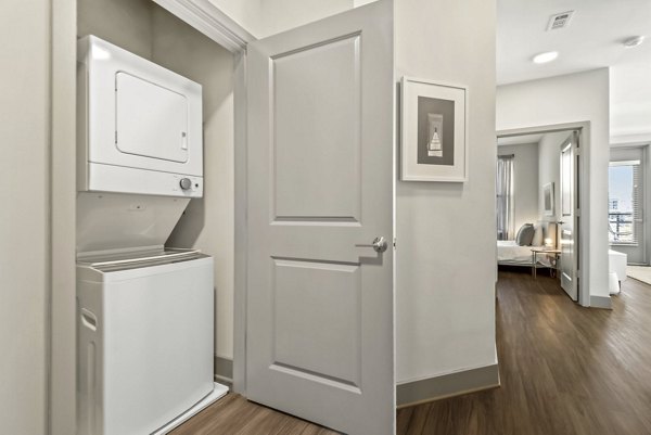 Laundry room with modern appliances at Union Heights Apartments, luxurious convenience for residents