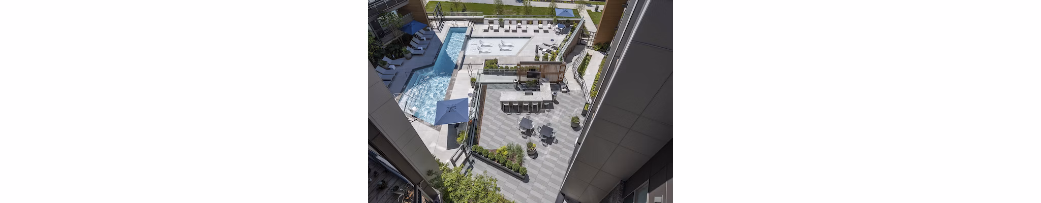 Modern outdoor pool area with lounge chairs at Union Heights Apartments