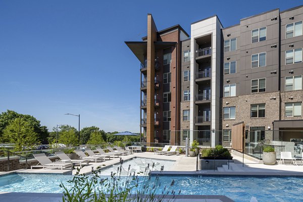 Luxurious pool area with lounge chairs at Union Heights Apartments offering resort-style relaxation