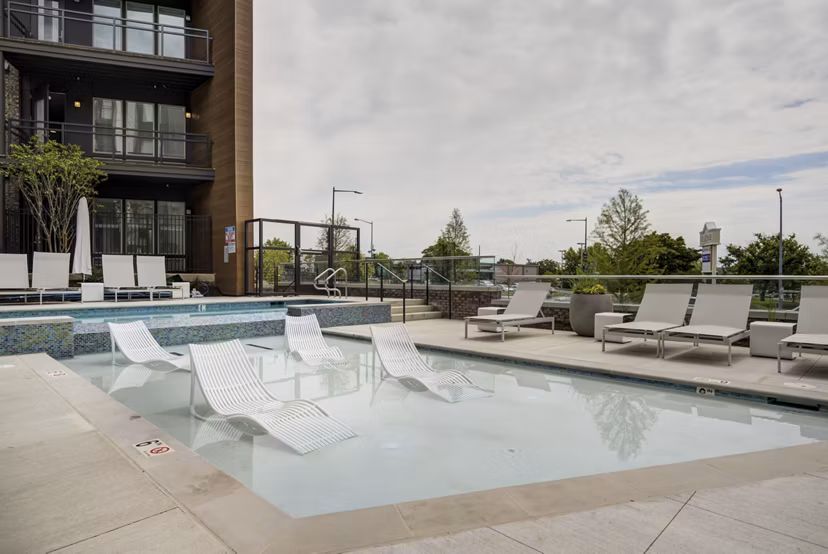 Modern pool with lounge chairs at Union Heights Apartments offering luxury living amenities