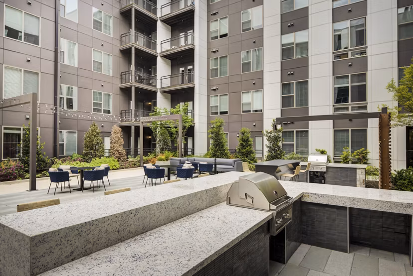 Outdoor grill area with modern seating at Union Heights Apartments, perfect for social gatherings and relaxation