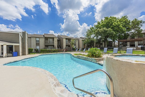 Luxurious pool with sun loungers at Circle at Point Park Apartments, perfect for relaxation and enjoyment